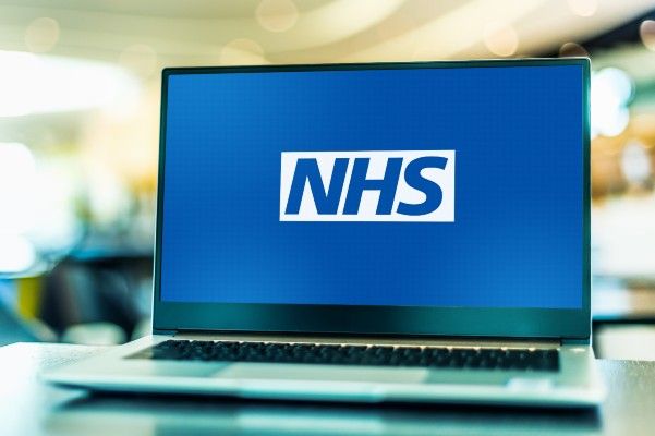 a laptop with the NHS logo